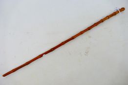 A bamboo swagger stick, 60 cm (l).