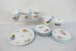 A Shelley tea service in the Wild Flowers pattern comprising six cups, six saucers, six side plates,