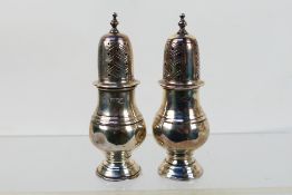 A pair of late Victorian silver pepperettes, London assay 1900, sponsors mark for Wakely & Wheeler,