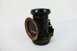A Jabez Bate & Co Verona oil fired bicycle lamp with 2" red lens, 11.5 cm (h).