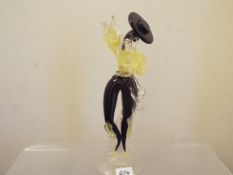 A Murano glass figurine depicting a flamenco dancer dressed in yellow and black,