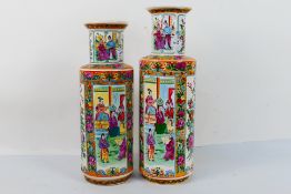 A decorative near pair of vases decorated with panels of figures against a floral ground,
