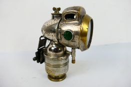 A Powell & Hanmer (P&H) Vulture chromed brass acetylene or carbide plated brass cased bicycle lamp,