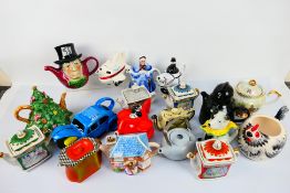 A collection of teapots, predominantly novelty examples to include Wade, Tony Wood and other. [2].