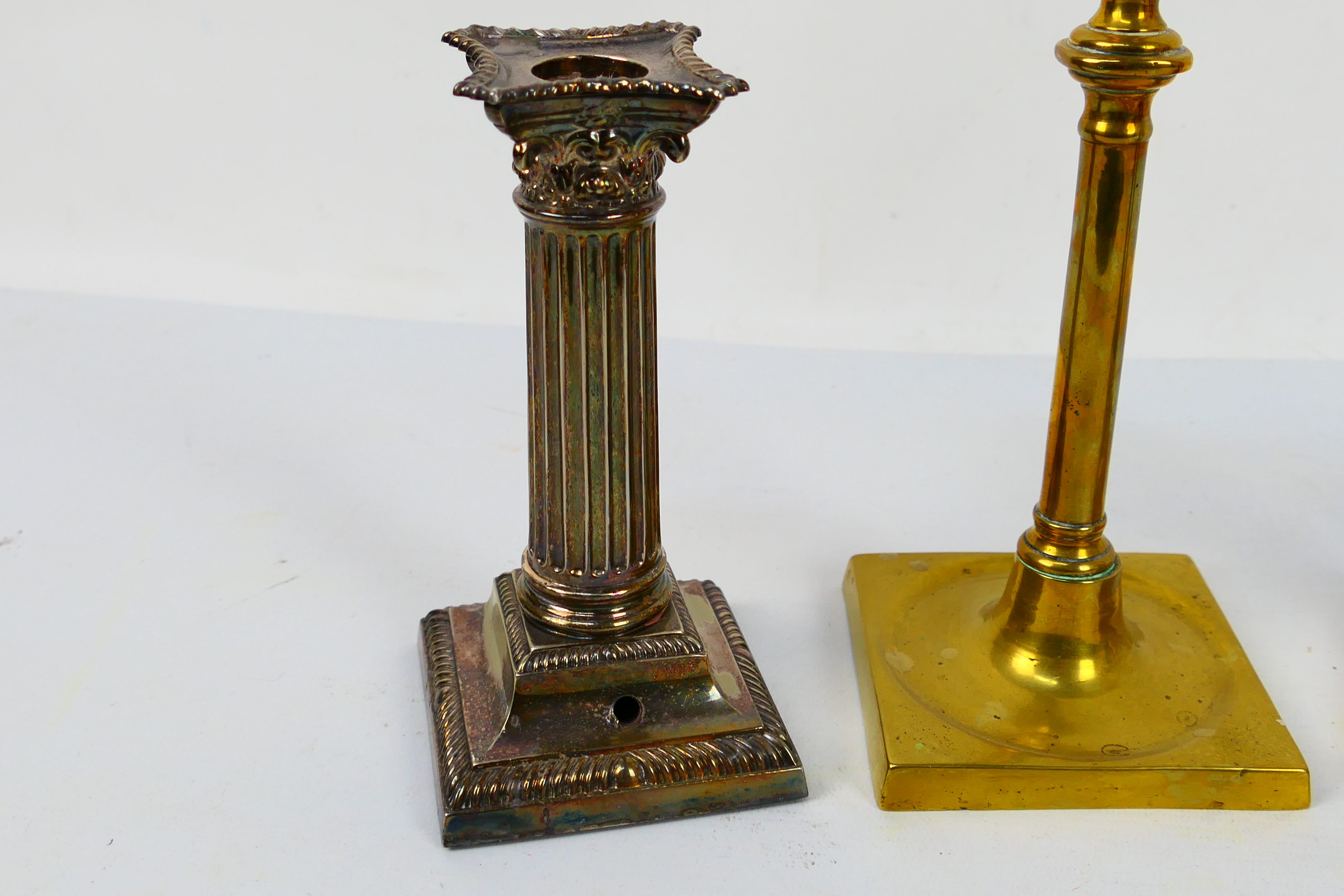 Two pairs of candlesticks comprising a pair of silver plated Corinthian column examples and a brass - Image 3 of 4