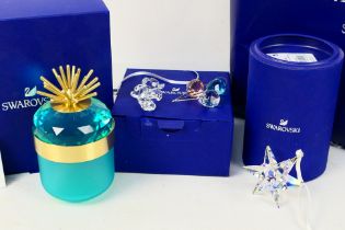 Swarovski - Three boxed models comprising a Jungle Beats collection decorative box and two smaller