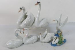 A collection of Lladro and Nao figures / groups of swans to include # 6585, Endless Love, # 5230,