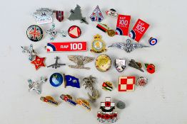 A quantity of pin badges, predominantly aviation related.