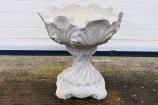 A reconstituted stone garden planter, approximately 49 cm (h).