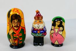 Russian Nesting Dolls - Two sets of Matryoshka dolls the first decorated with The Beatles, John,