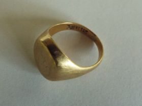 A yellow metal signet ring stamped 9ct, approx 4.