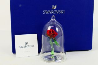 Swarovski - A boxed Disney Beauty and the Beast Enchanted Rose and Dome, box with outer card sleeve.