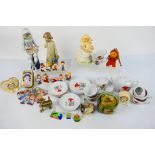 Lot to include a child's tea set, glass Disney figures, miniature clocks, Nao figure,