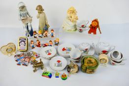 Lot to include a child's tea set, glass Disney figures, miniature clocks, Nao figure,