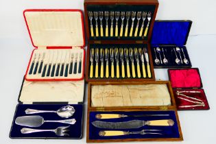 Cased flatware including a set with silver mounts.