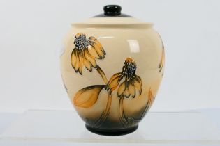 Moorcroft Pottery - A Moorcroft Pottery vase and cover decorated in the Coneflower pattern,