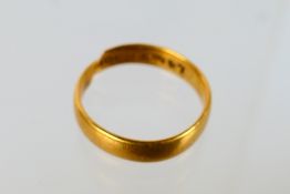 Scrap Gold - A 22ct yellow gold wedding band (band cut), approximately 4.