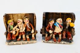 A pair of Runnaford Pottery Will Young settle groups depicting characters from Uncle Tom Cobley,