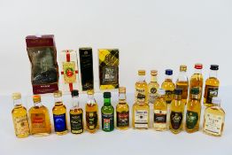 A collection of twenty two miniature bottles of blended whisky, 40% abv,