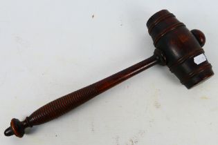 A large mahogany gavel with turned handle, approximately 37 cm (l).