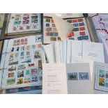 Stamps - a collection of UK mint postage stamps with a face value in excess of £500 mounted in a