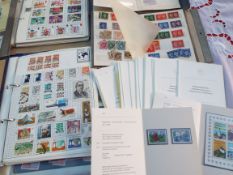 Stamps - a collection of UK mint postage stamps with a face value in excess of £500 mounted in a