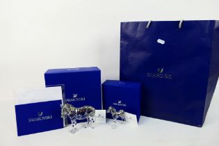 Swarovski - Two boxed Swarovski Crystal Society models comprising a zebra and baby zebra,