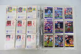 A binder of Merlin Rugby League trade cards.
