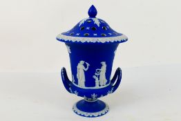 A Wedgwood Portland Blue Jasperware potpourri vase of Campana urn form with pierced domed cover,