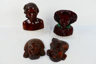 Four carved wood busts / wall masks, largest approximately 26 cm (h).