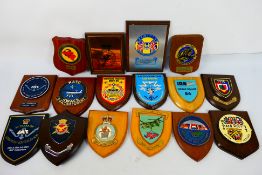 A collection of commemorative wooden shield plaques to include squadron, NATO AWACS,