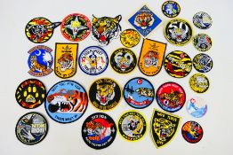 A collection of NATO Tiger Meet cloth patches, various squadrons, 1990's to 2000's.