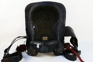 A black leather Western type saddle.