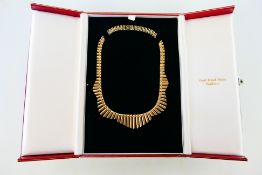 A 9ct gold collarette necklace, 38 cm (l), approximately 27 grams.