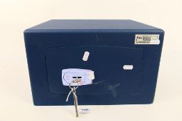 A small Burton Safe Company metal safe, two keys, approximately 22 cm x 35 cm x 30 cm.