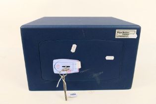 A small Burton Safe Company metal safe, two keys, approximately 22 cm x 35 cm x 30 cm.