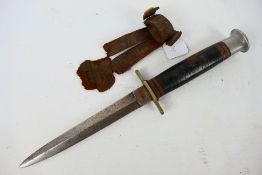 A W H Fagan & Son Fairbairn Sykes style fighting knife, 14 cm blade, with remains of leather sheath.