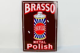 An enamel advertising sign for Brasso Metal Polish, approximately 52 cm x 35.5 cm.