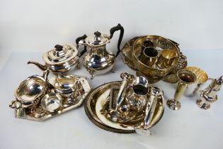 A collection of various plated ware to include trays, teapot, vases and other.