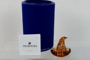 Swarovski - A boxed Harry Potter model depicting the Sorting Hat, approximately 5 cm (h).