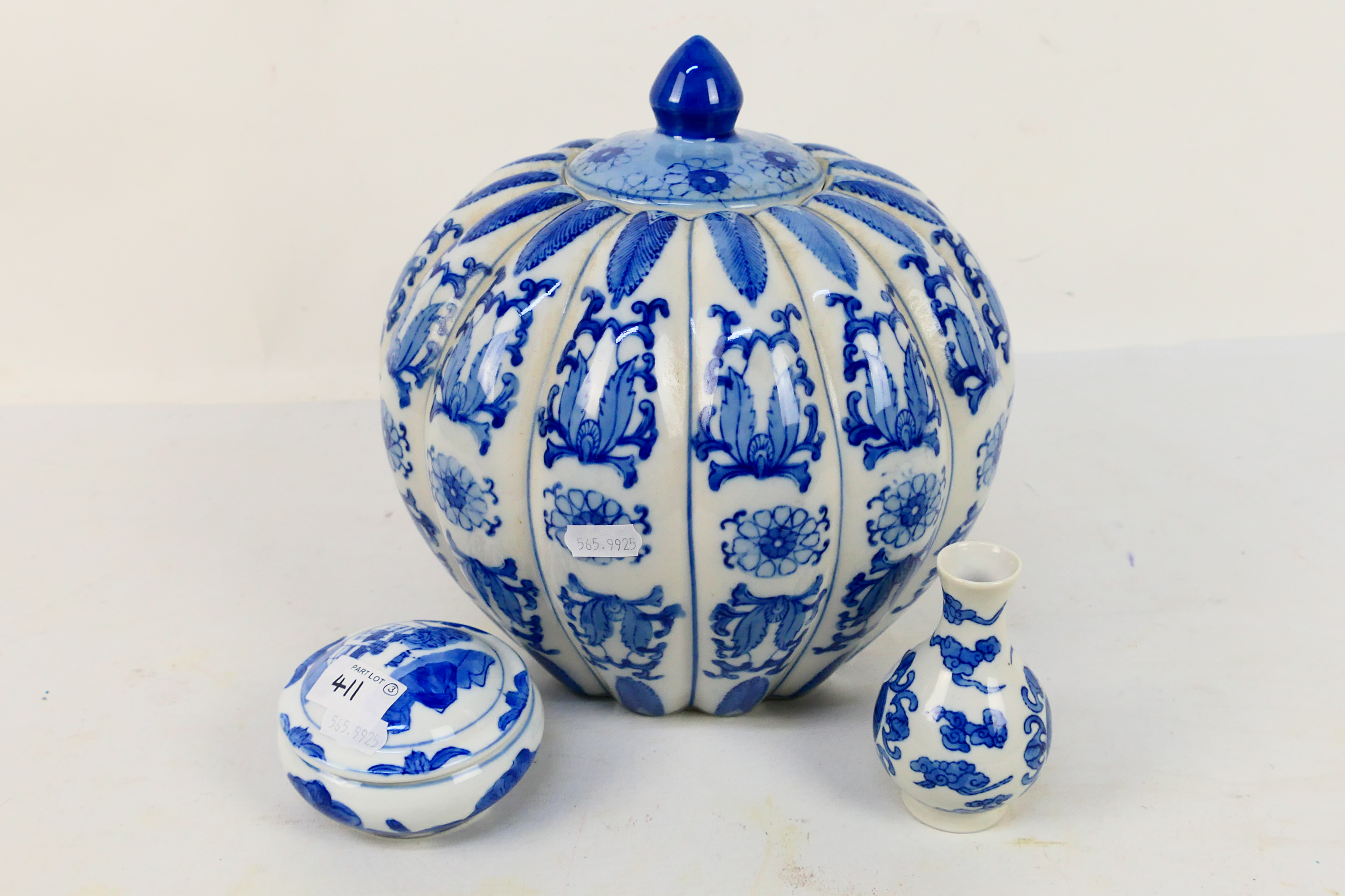 A blue and white jar and cover, a small vase decorated with Shou character,