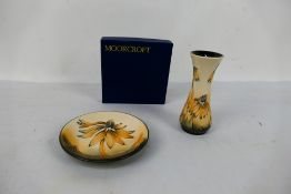 Moorcroft Pottery - Two pieces decorated in the Coneflower pattern comprising a coaster, 12 cm (d),