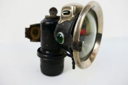 A Powell & Hanmer (P&H) Panther De Luxe acetylene or carbide bicycle lamp with 3" clear convex lens