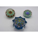 Three millefiori paperweights, one of star section.