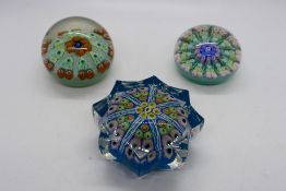 Three millefiori paperweights, one of star section.