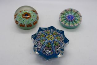 Three millefiori paperweights, one of star section.