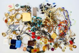 A quantity of various costume jewellery to include earrings, necklaces, brooches and other.