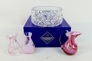 A boxed Edinburgh Crystal bowl, two decorative glass vases and a jug.