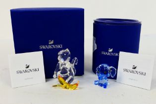 Swarovski - Two boxed crystal figures comprising Dreamy The Elephant and Monkey With Banana,