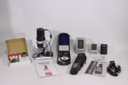 A Traveler USB Microscope, Magellan GPS system, clock and hygrometer and other. [2].